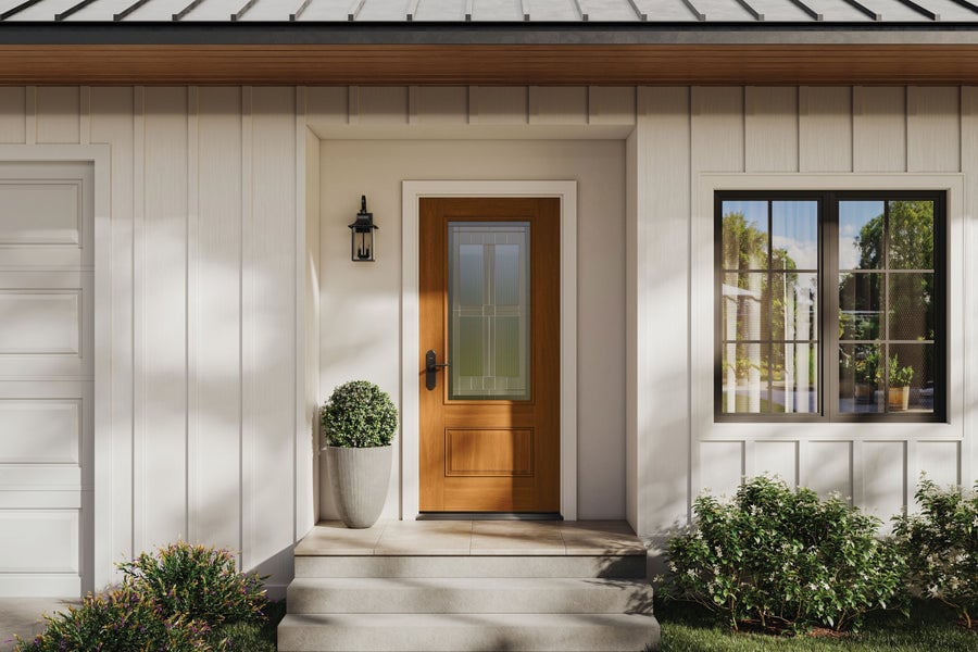Residential front entry door with decorative glass and sidelight