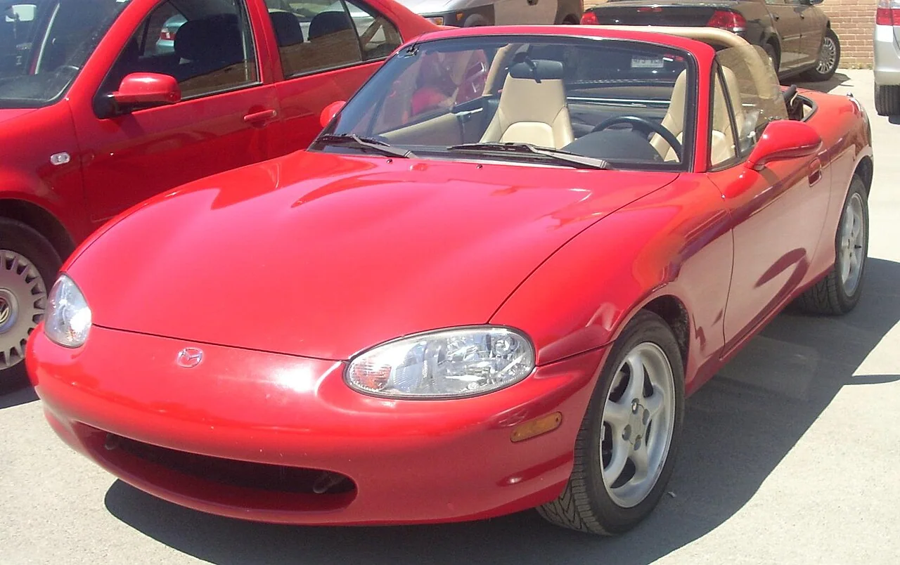 2000 Mazda MX-5 Miata — representative vehicle generation; Original North American NB bumper and headlamp design