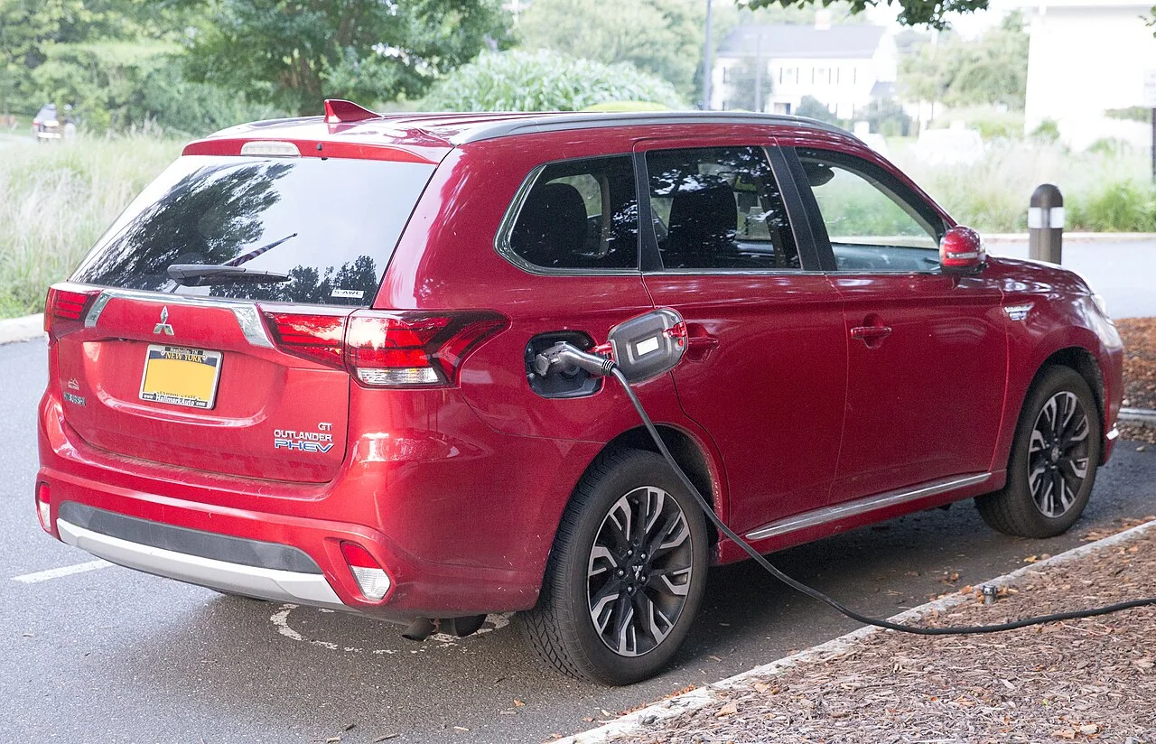 2018 Mitsubishi Outlander PHEV — representative vehicle generation; 2018 US GT rear view while charging