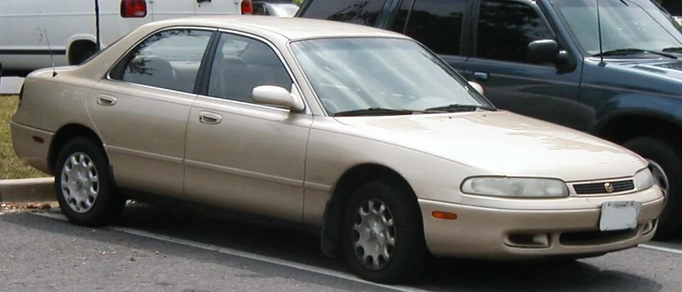 1993–1995 Mazda 626 — representative vehicle generation; Original North American GE grille and headlamp design