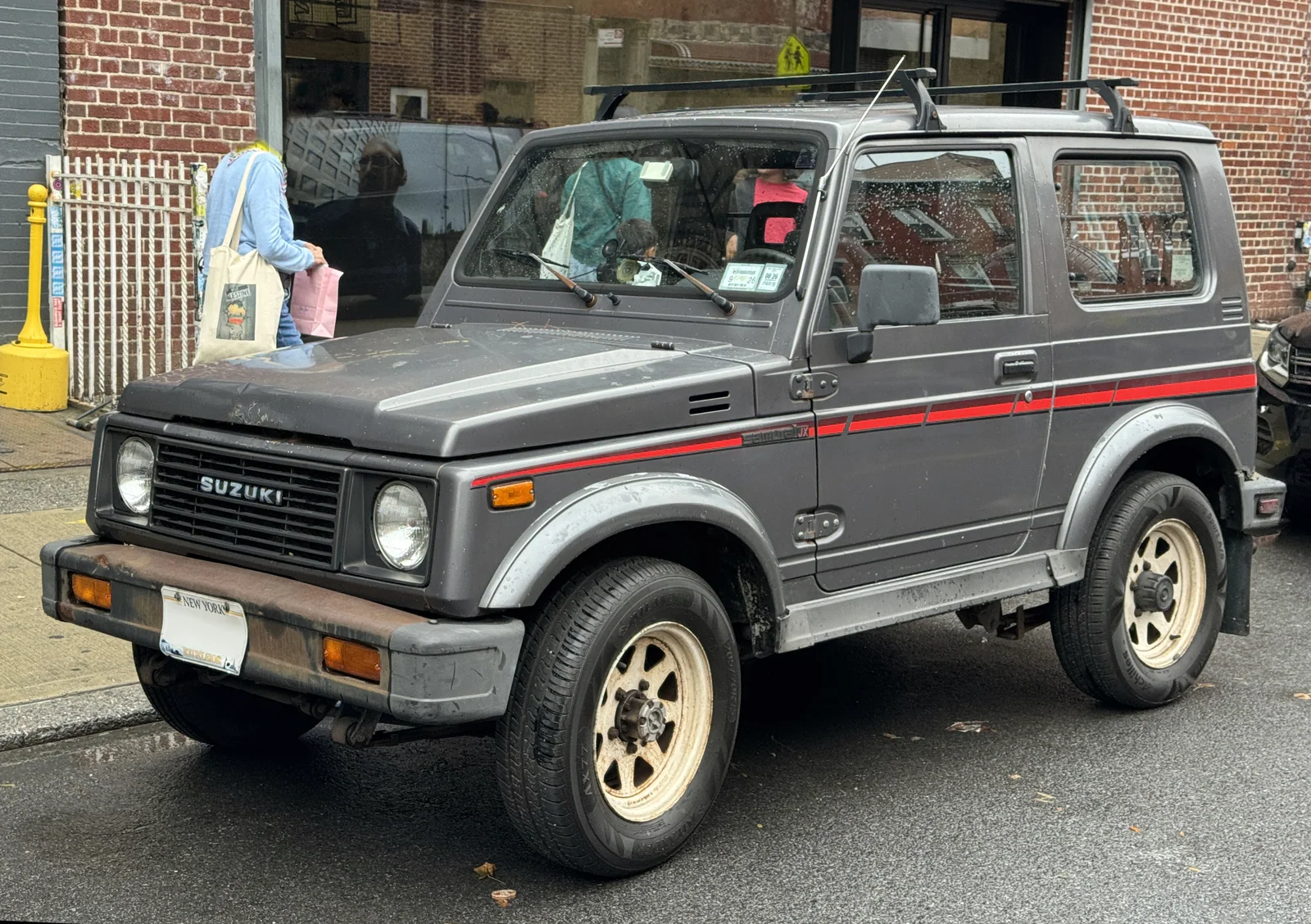 1986–1989 Suzuki Samurai — representative vehicle generation; 1987 US JX hardtop example; roof rack shown