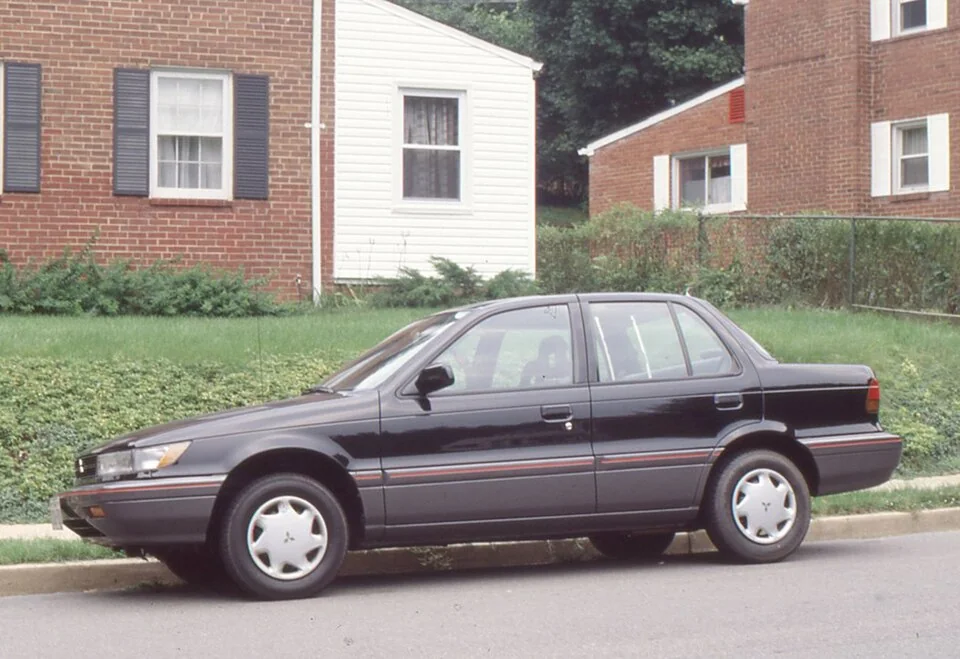 1989–1990 Mitsubishi Mirage — representative vehicle generation; 1990 US sedan example photographed when new