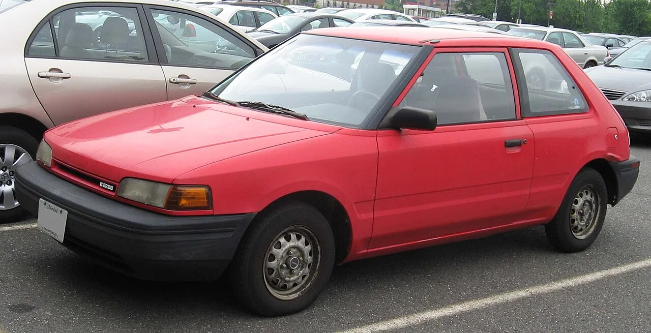 1990–1992 Mazda 323 — representative vehicle generation; Original North American BG hatchback grille and front design