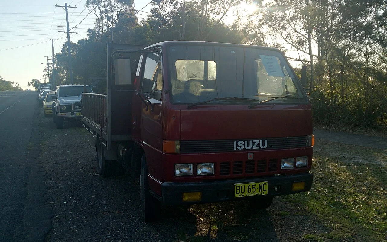 Period Isuzu N-series cab shown as a family reference, not an exact NRR chassis photograph.