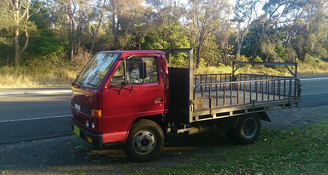 Period Isuzu N-series cab shown as a family reference, not an exact NRR chassis photograph.